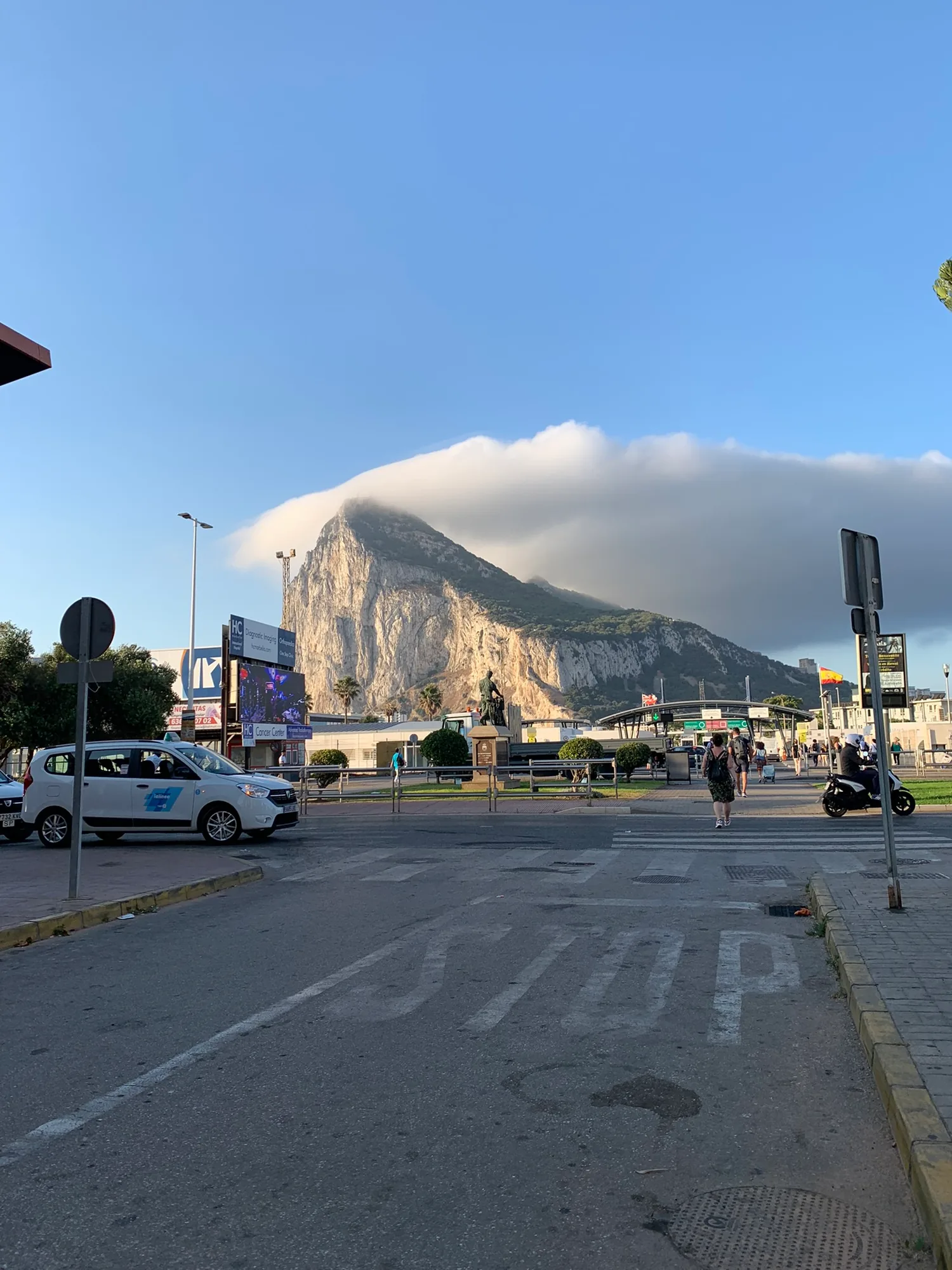 The frontier plaza in La Linea, the Rock of Gibraltar under a levanter cloud cap.