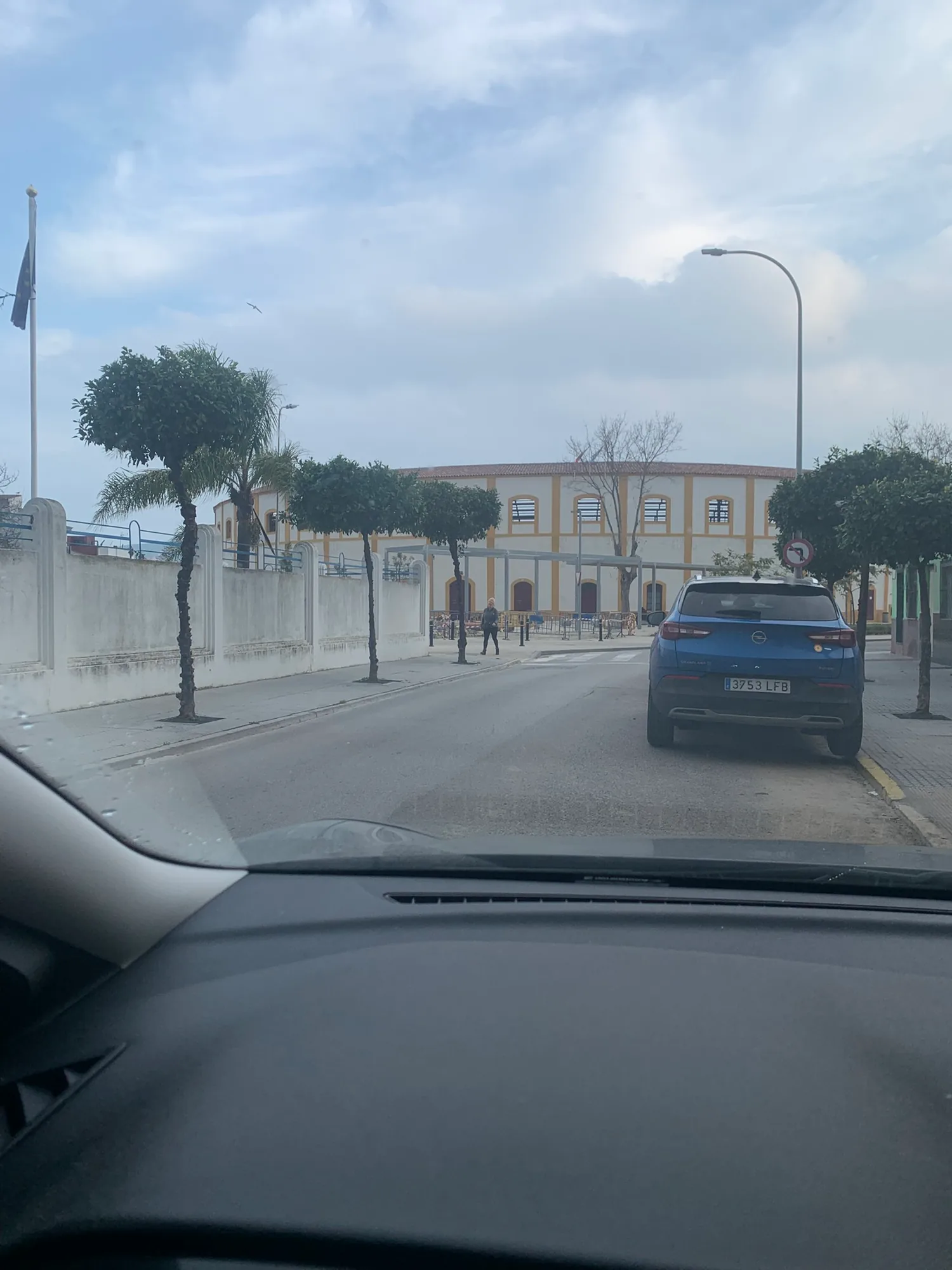 Historic yellow building on a La Línea street