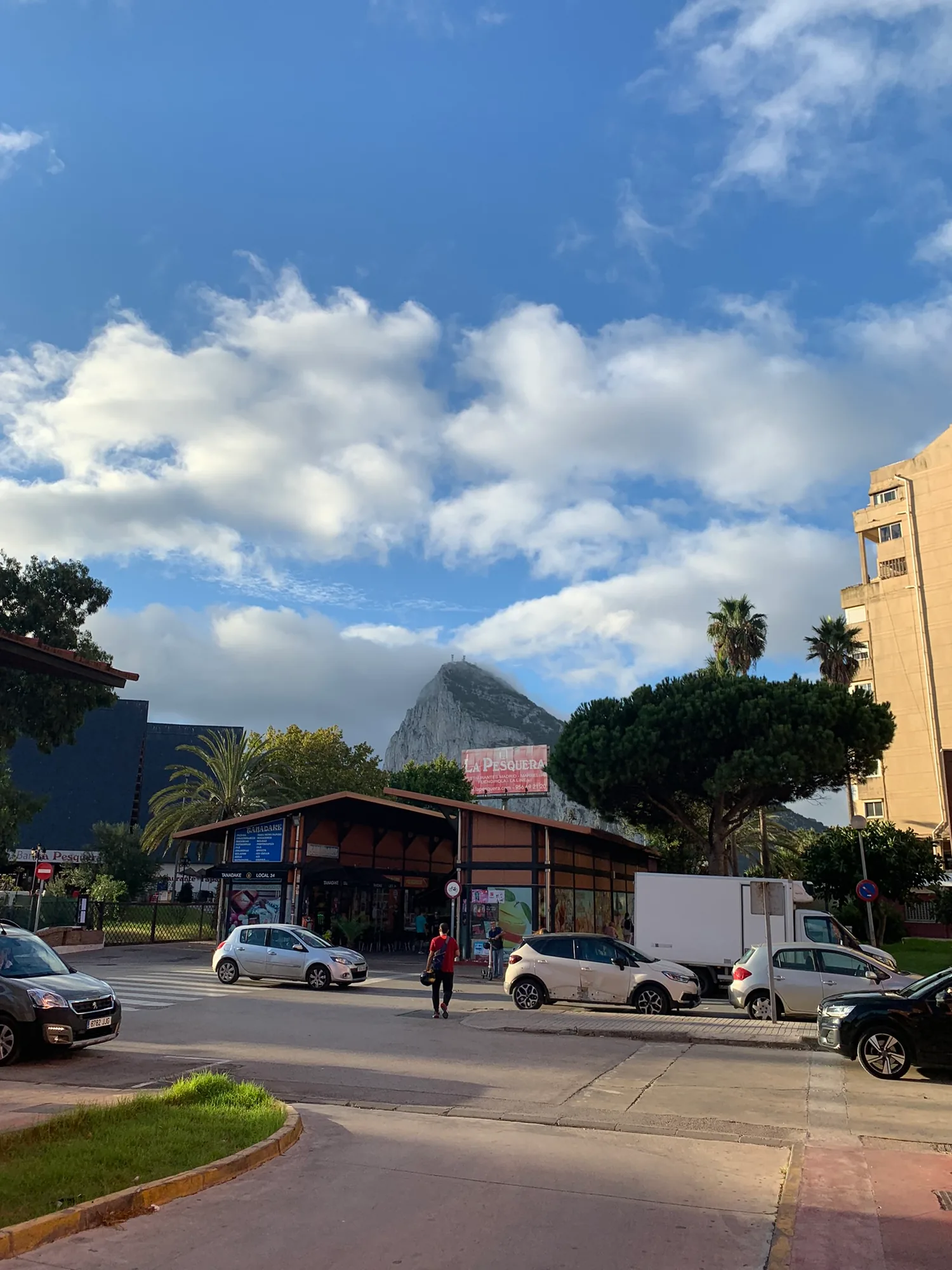 La Pesquera market building in La Línea with the Rock of Gibraltar behind