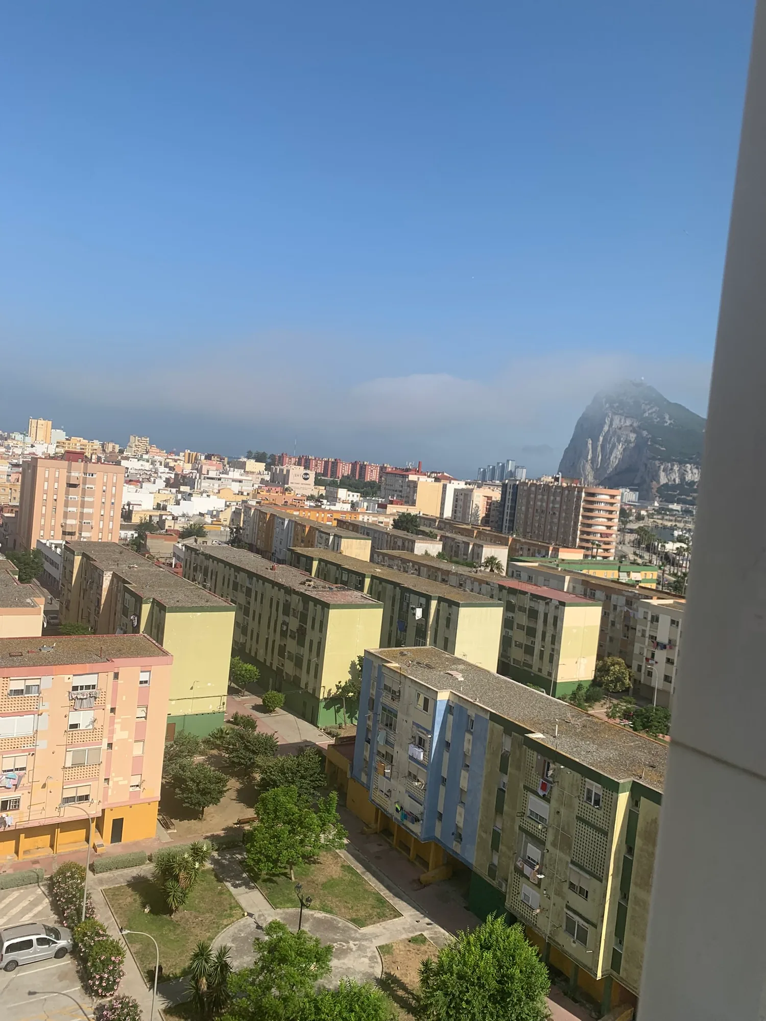 Residential apartment blocks in La Línea with the Rock of Gibraltar behind