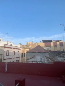 A La Linea rooftop terrace, its tiled floor under the moon.