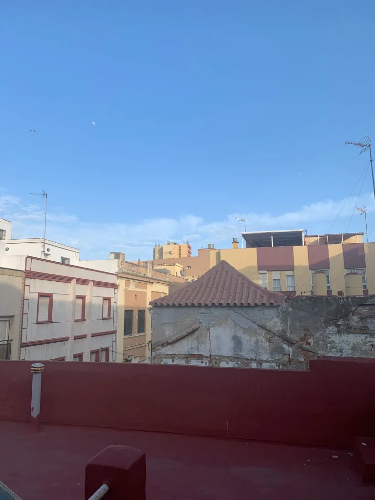 A La Linea rooftop terrace, its tiled floor under the moon.